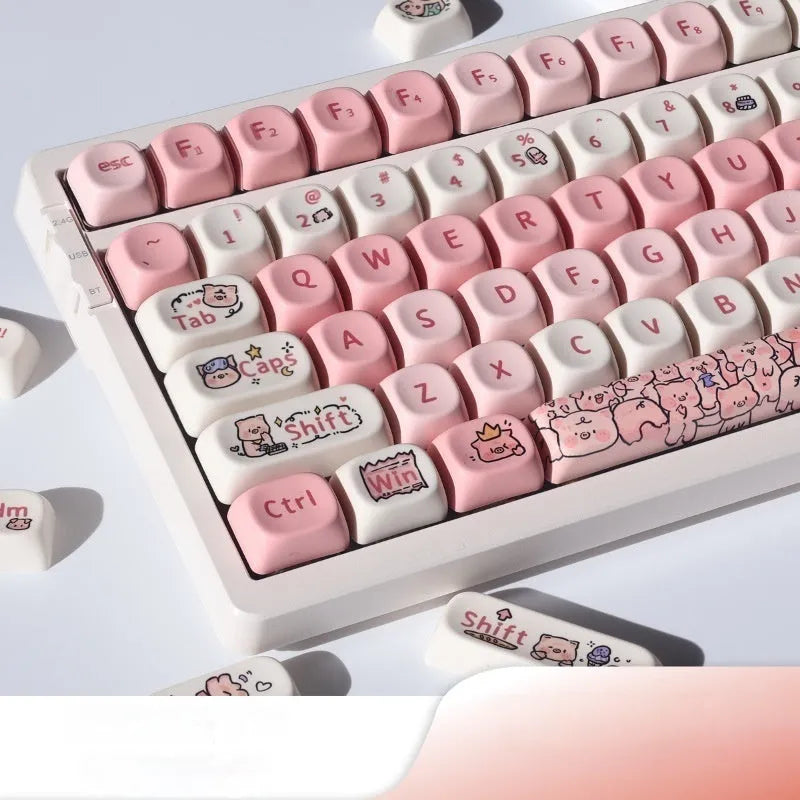 Pink mechanical keyboard keycap with a detailed fragrant pig design on all sides, shown next to a keycap puller tool.