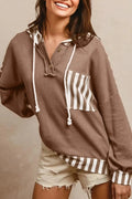 Straw yellow waffle texture hoodie with striped patchwork panels and a button neck.