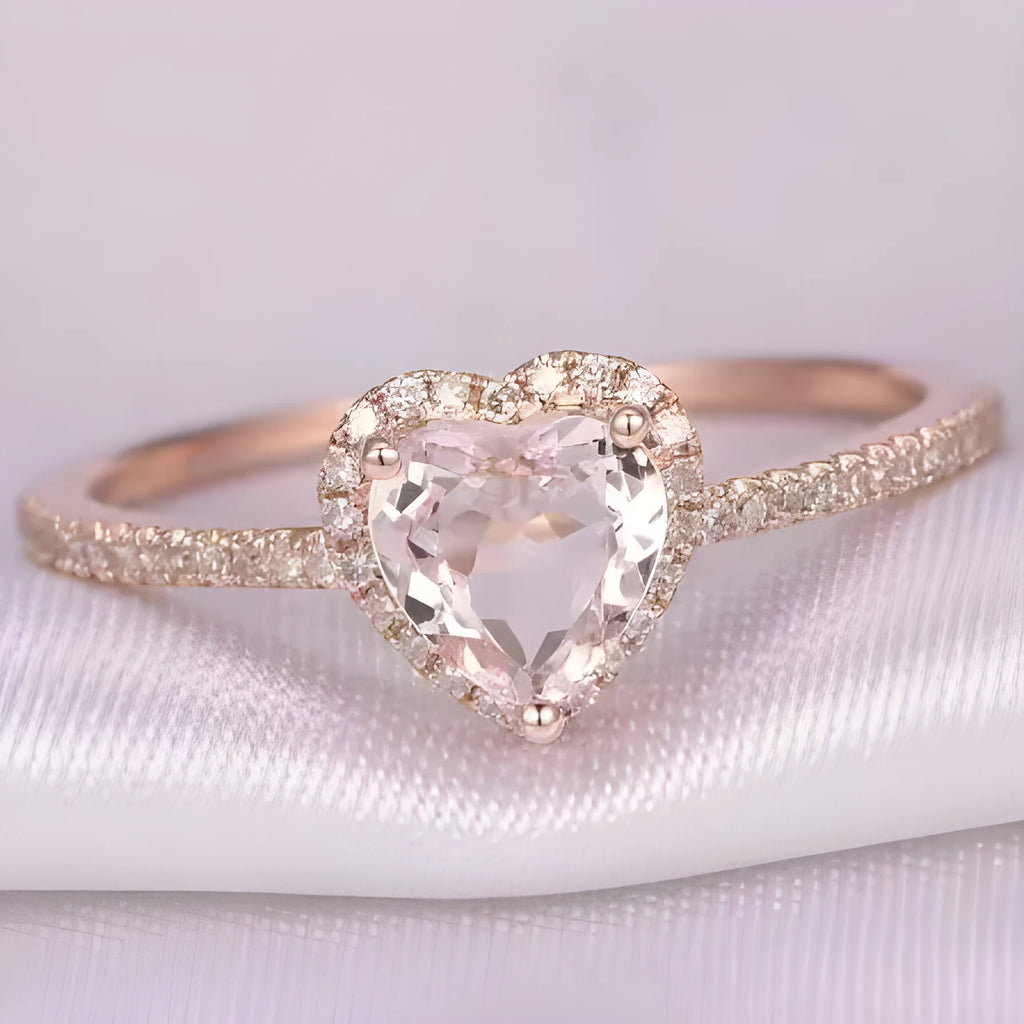 Women's heart-shaped crystal ring in rose gold or silver tone on a white background
