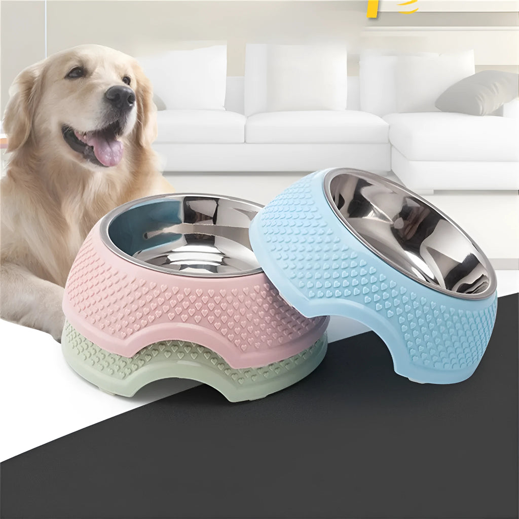 Blue stainless steel pet bowl with a non-slip black base on a kitchen floor.