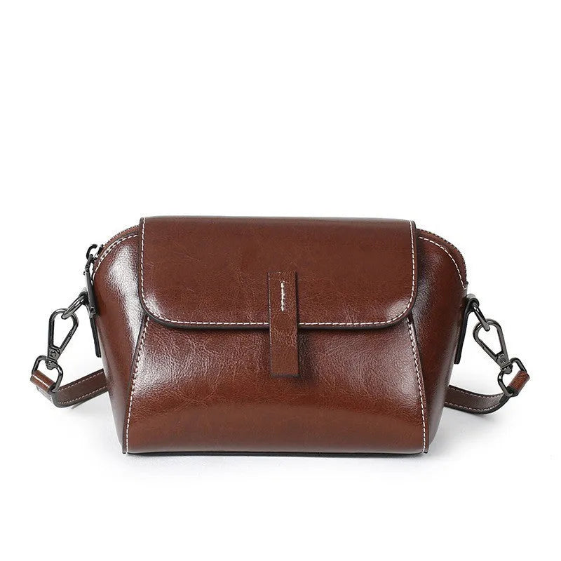 Brown genuine oil wax leather women's messenger bag with shell shape and single cross-body strap