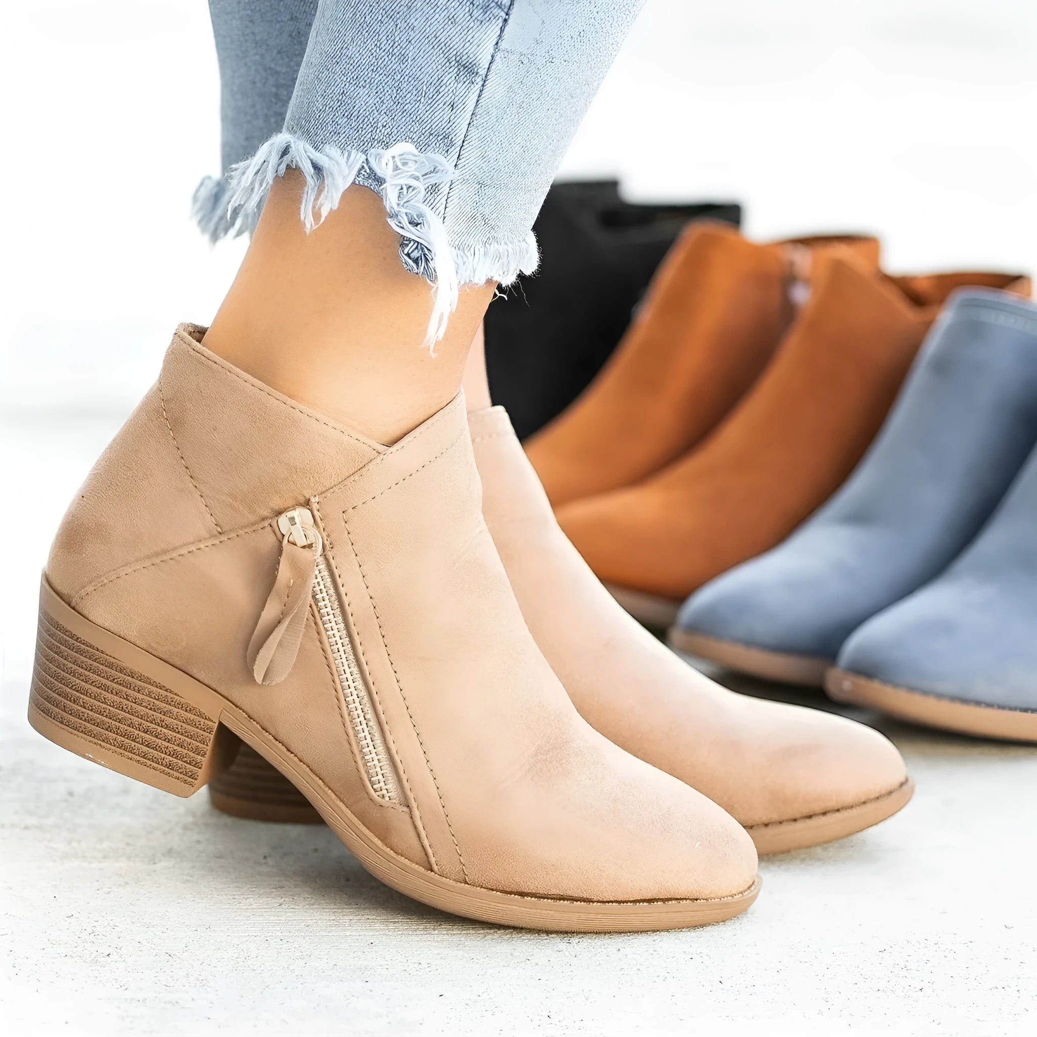 Blue Dr Martens women's suede ankle boots with a side zip and chunky heel