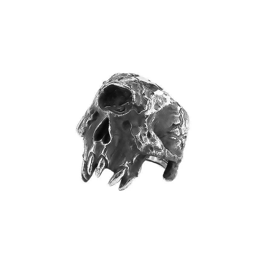 Alloy skull ring with one-eyed design and electroplated metallic finish shown on hand