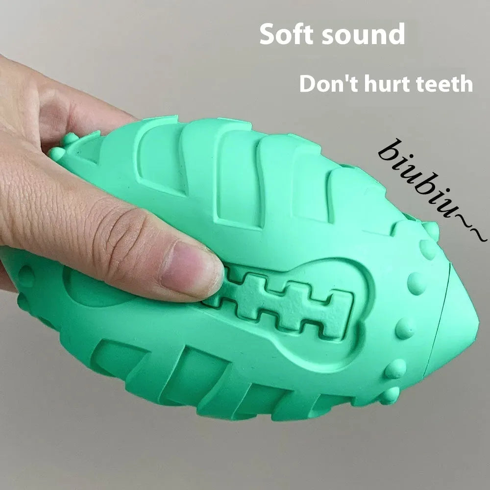 Bite-resistant rubber rugby ball dog toy in light green for teeth cleaning and training