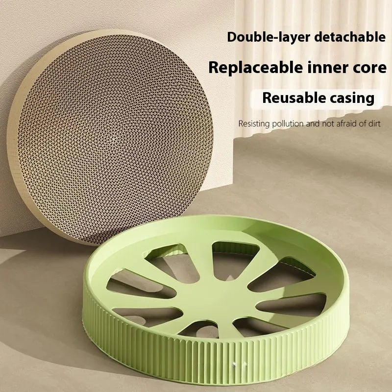 Round green cat scratching board with corrugated paper insert measuring 55cm diameter with two replacement refills
