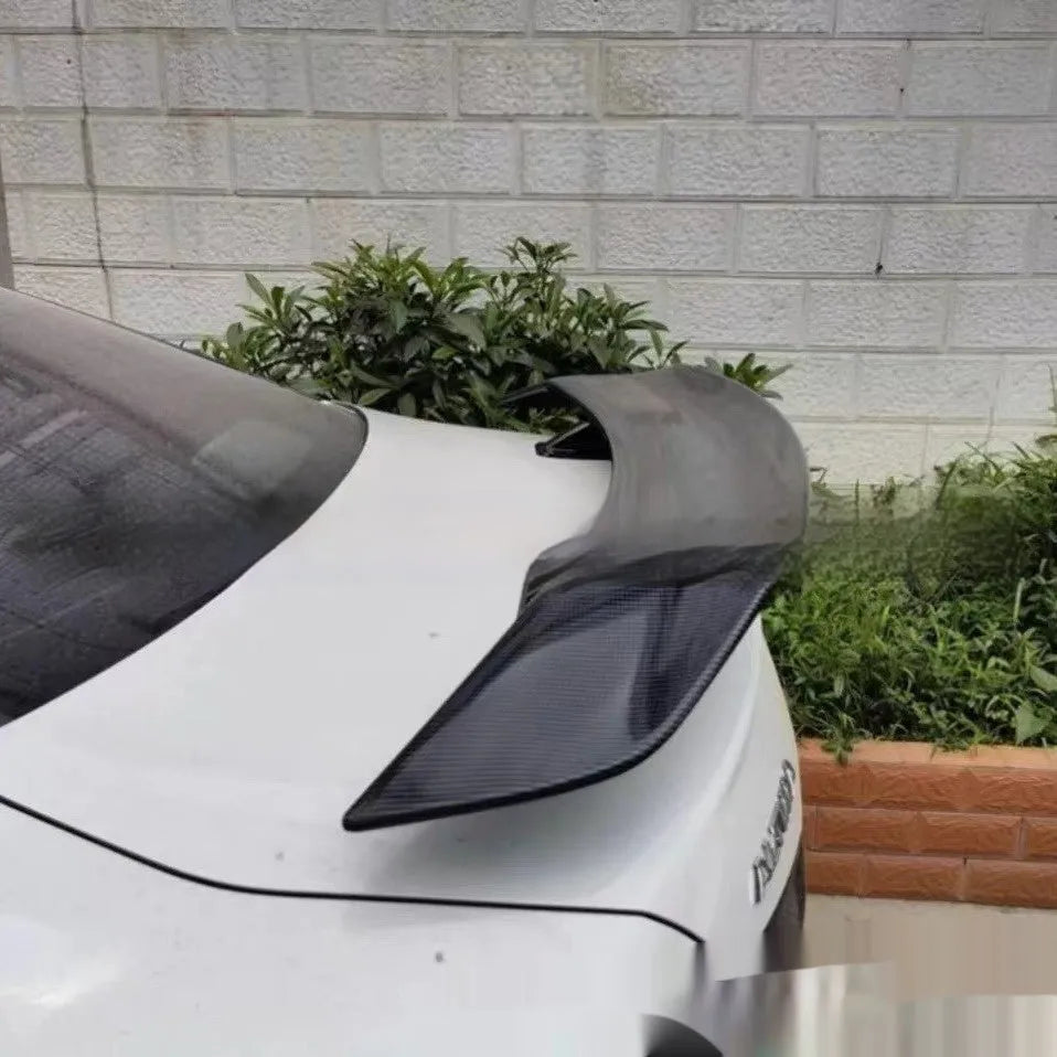Universal punch-free car spoiler made from ABS plastic, shown in bright black finish.