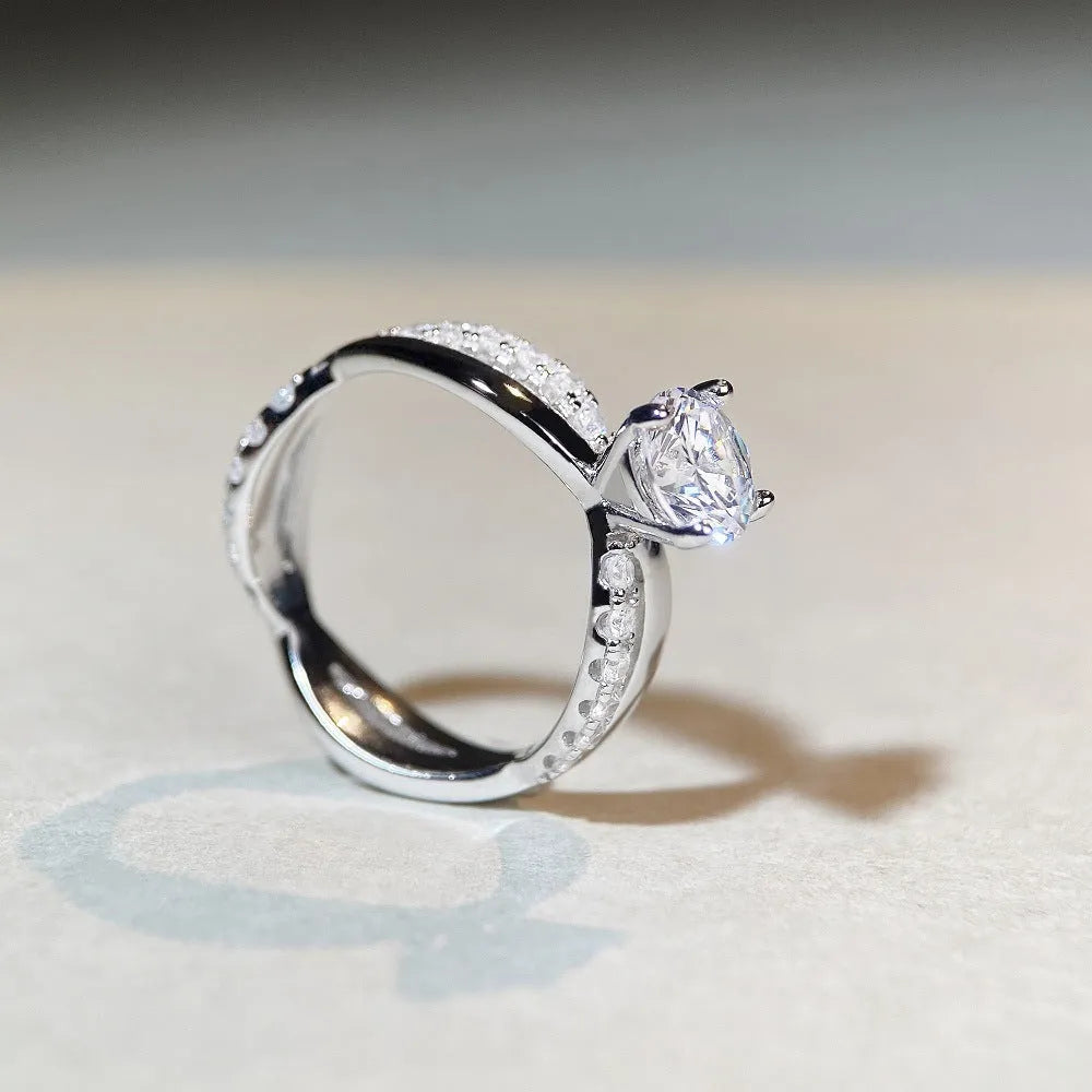 White Diamond 1 karat moissanite ring with twisted Sterling Silver band and four-claw setting.