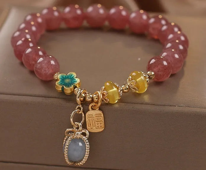 Red strawberry quartz beaded bracelet with alloy metal accents and rhinestone decorative details for women