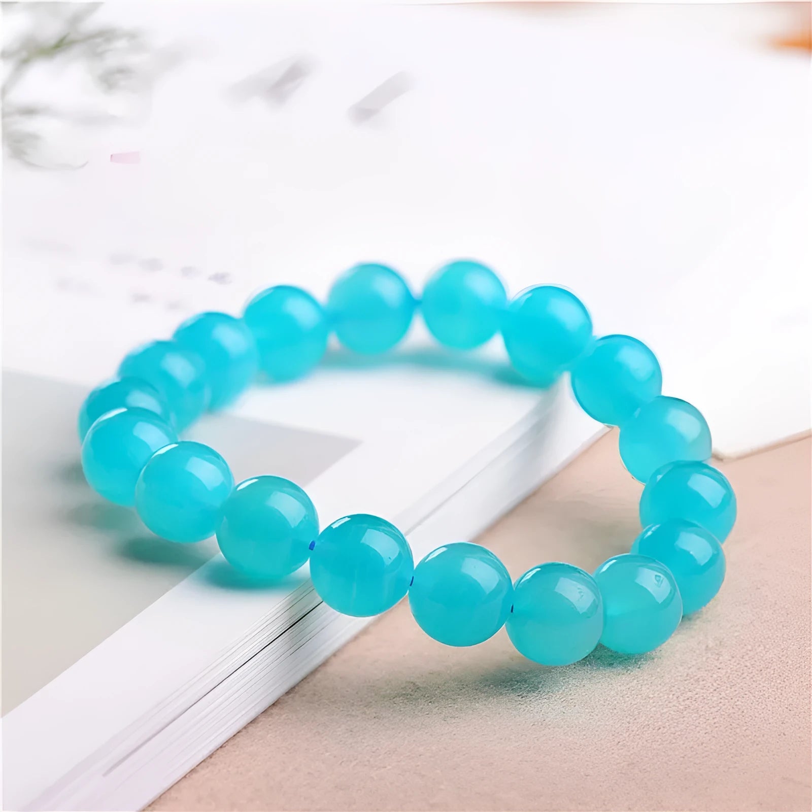 Grade 7A Amazonite natural scattered beads in ice blue and green, showing polished round and three-ring bead styles for bracelet making.