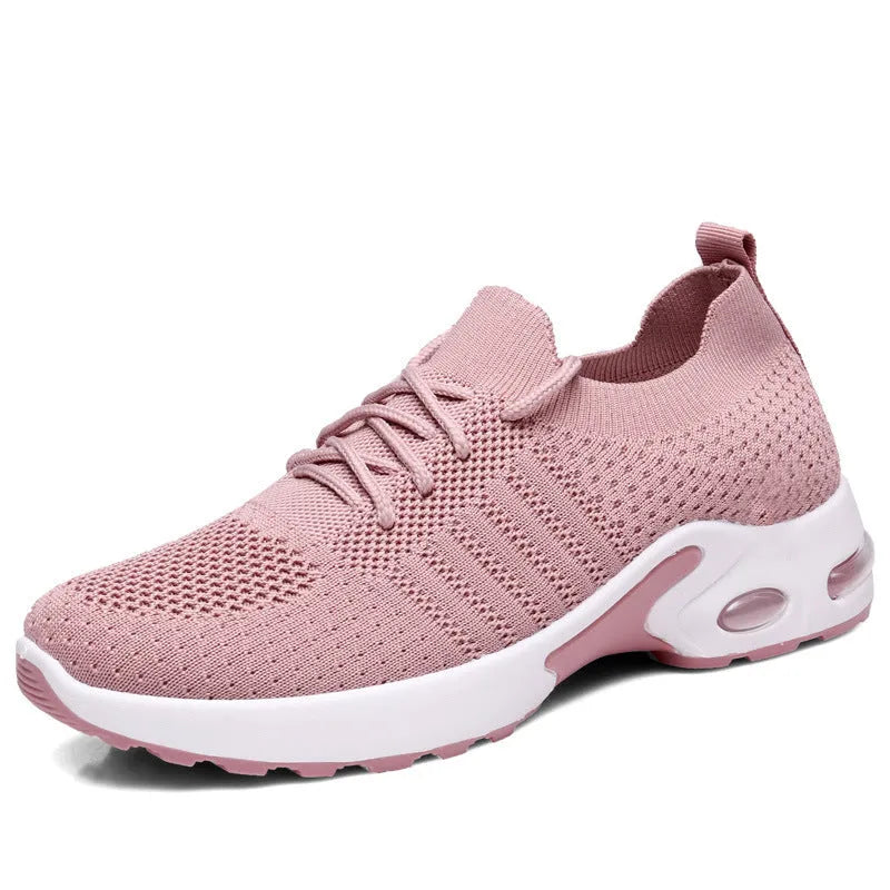 Women's black mesh casual sneakers with round toe and white non-slip PVC sole on a light background.