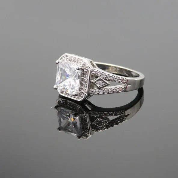 Geometric hollow women's ring with zircon stones in platinum colour