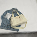 Polyester shoulder bag for women with phone compartment and sandwich pockets in solid colour options