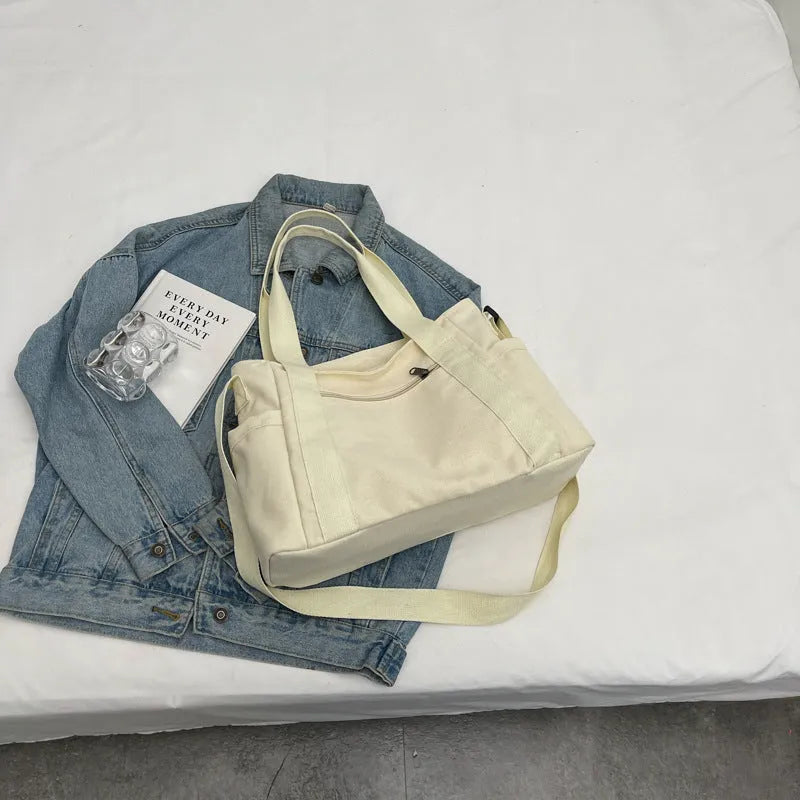 Polyester shoulder bag for women with phone compartment and sandwich pockets in solid colour options