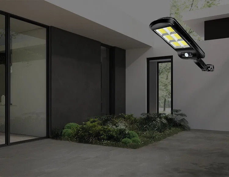 Black solar motion sensor street light for outdoor garden and pathway security lighting