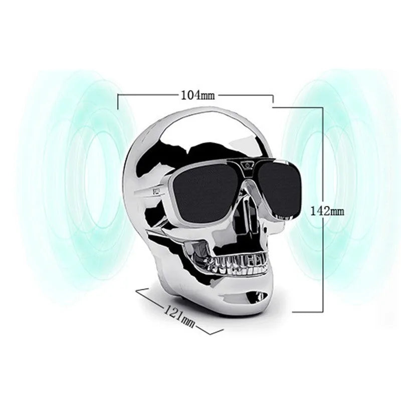 Skull-themed portable wireless Bluetooth speaker in choice of six colours on a table.