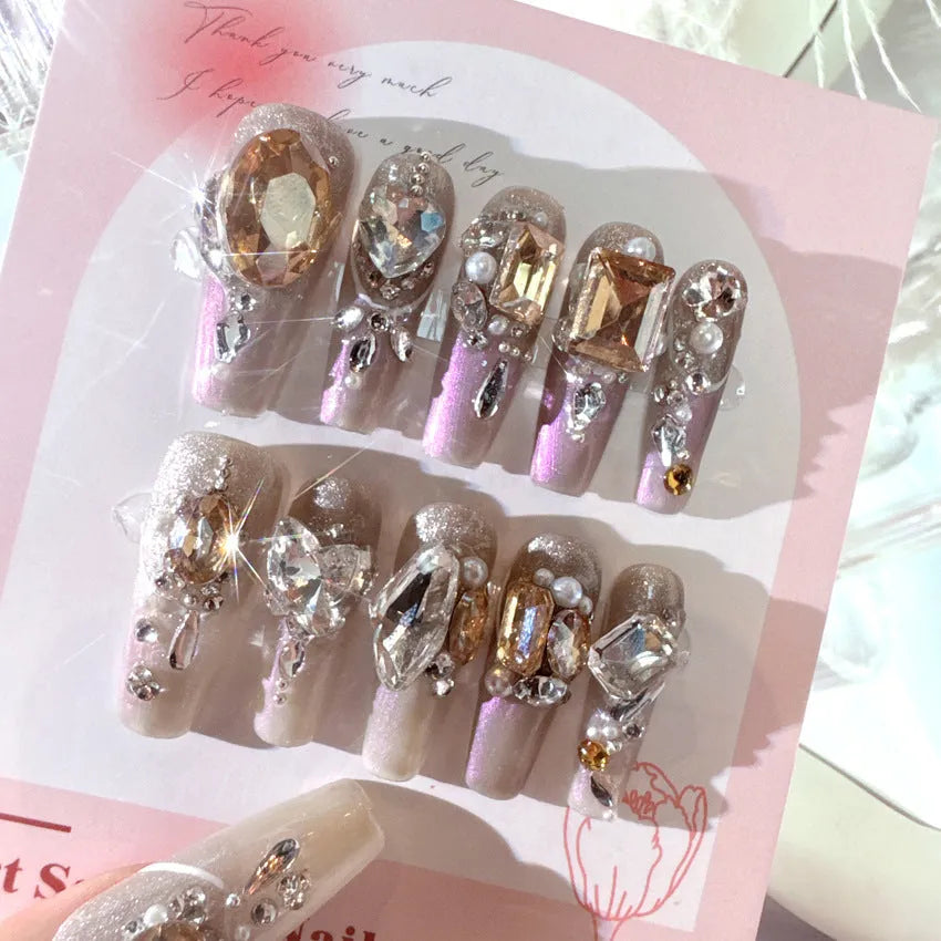 Rhinestone-decorated false nail patches with application kit options on card packaging