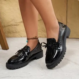 Women's brown loafers with decorative bow detail on artificial PU upper
