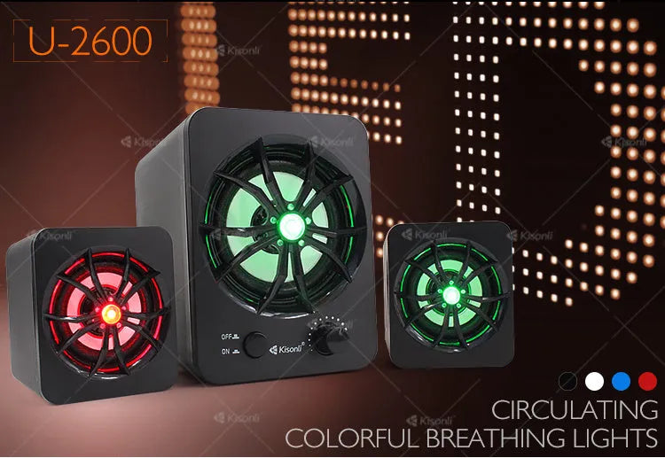 Green U-2600 2.1 USB computer speaker with colourful LED lights on a desktop.