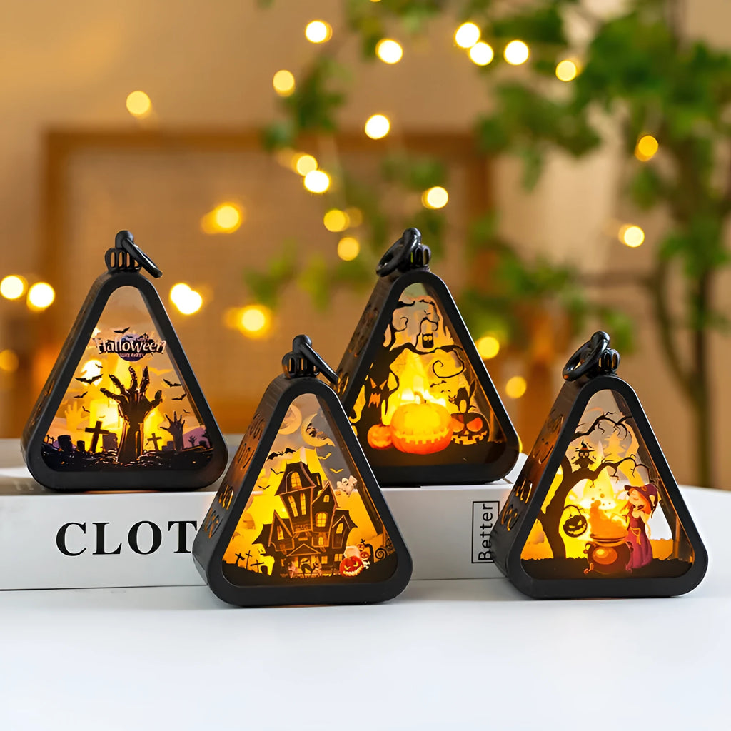 Halloween pumpkin lamp decoration prop in plastic and glass, showing one of four available colour designs.