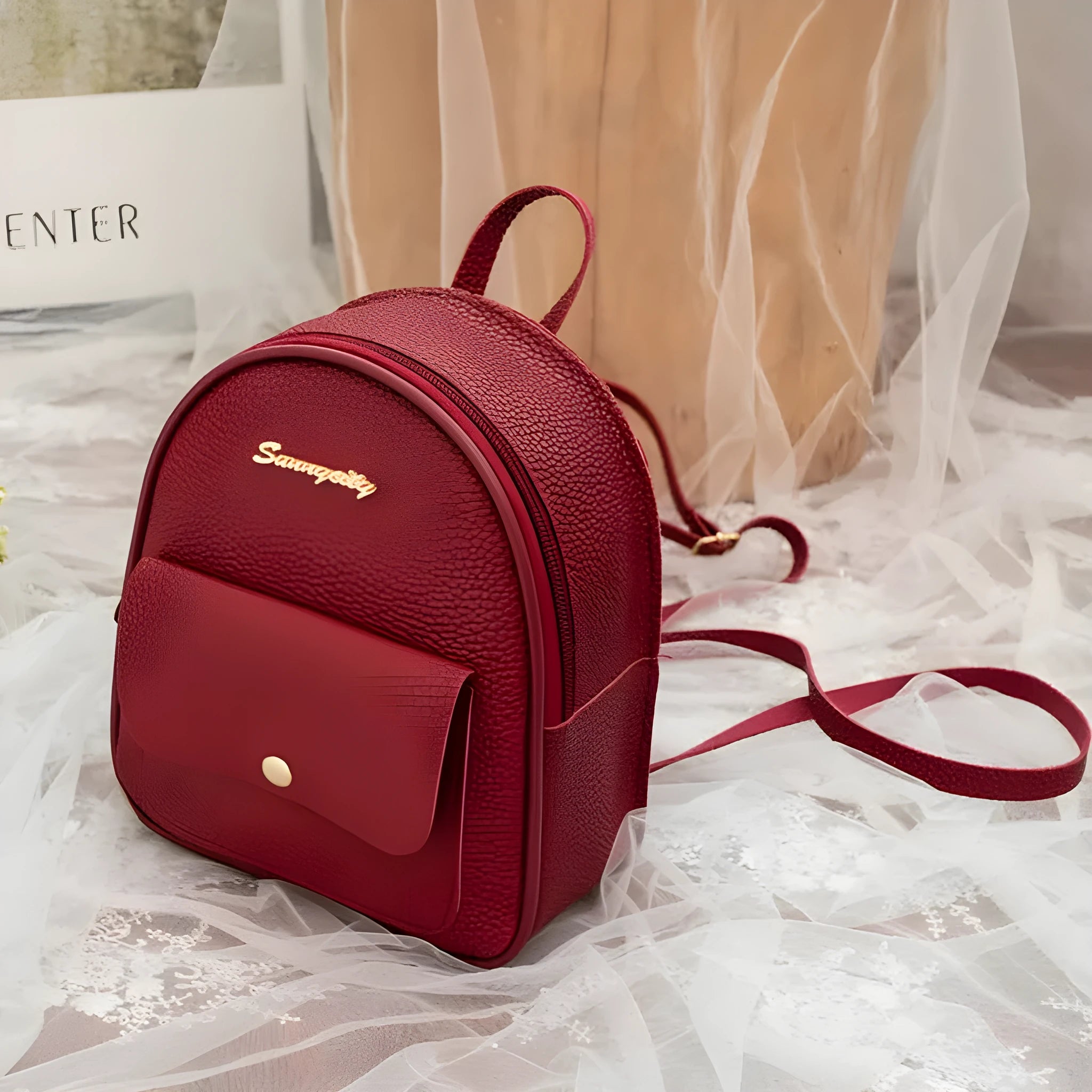 Small PU leather shoulder backpack in black colour showing zipper closure and compact dimensions