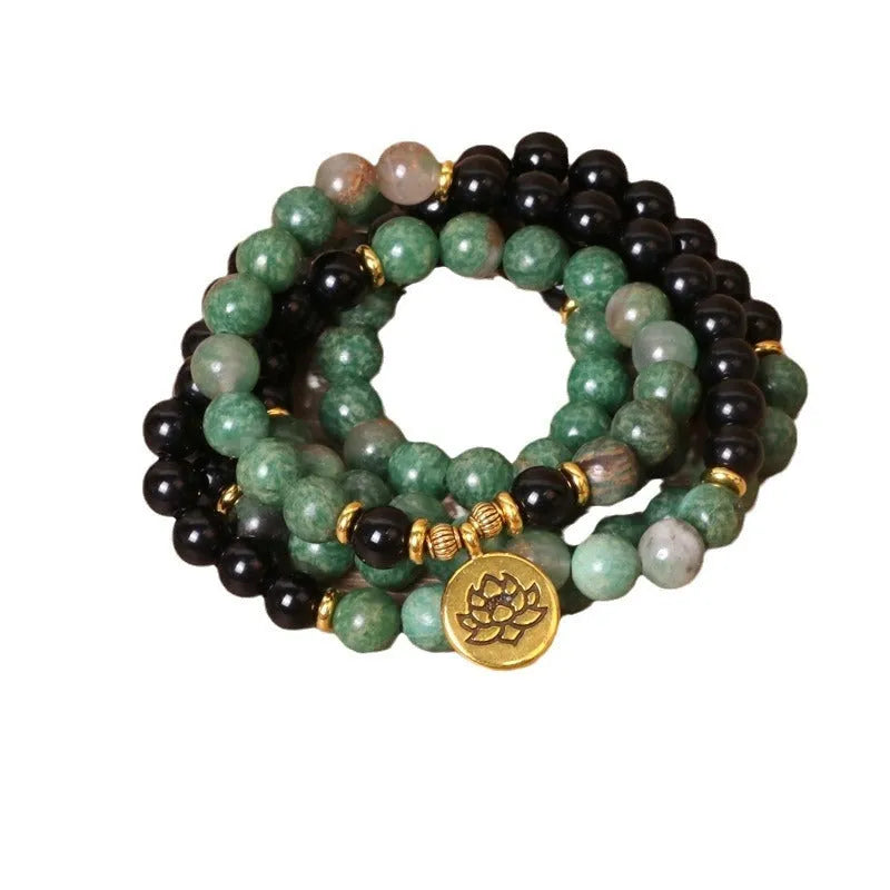 Green and black elastic beaded bracelet with alloy construction for women's wrist jewellery