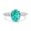 S925 silver ring with a genuine green emerald in a palaibahao setting, surrounded by inlaid high carbon diamonds on a geometric band.