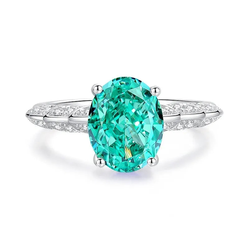S925 silver ring with a genuine green emerald in a palaibahao setting, surrounded by inlaid high carbon diamonds on a geometric band.