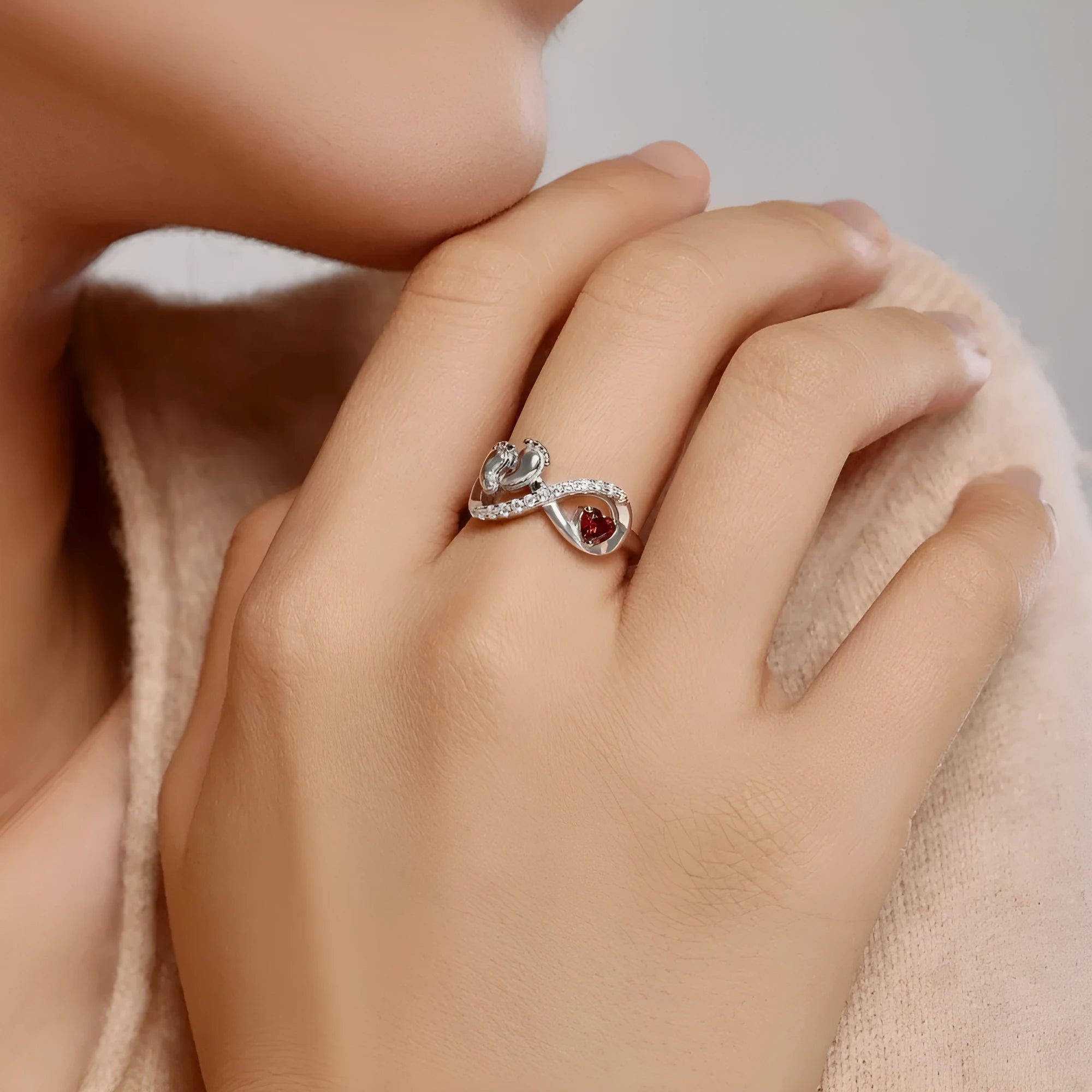 Silver geometric ring with rose red electroplated finish featuring new baby footprints design