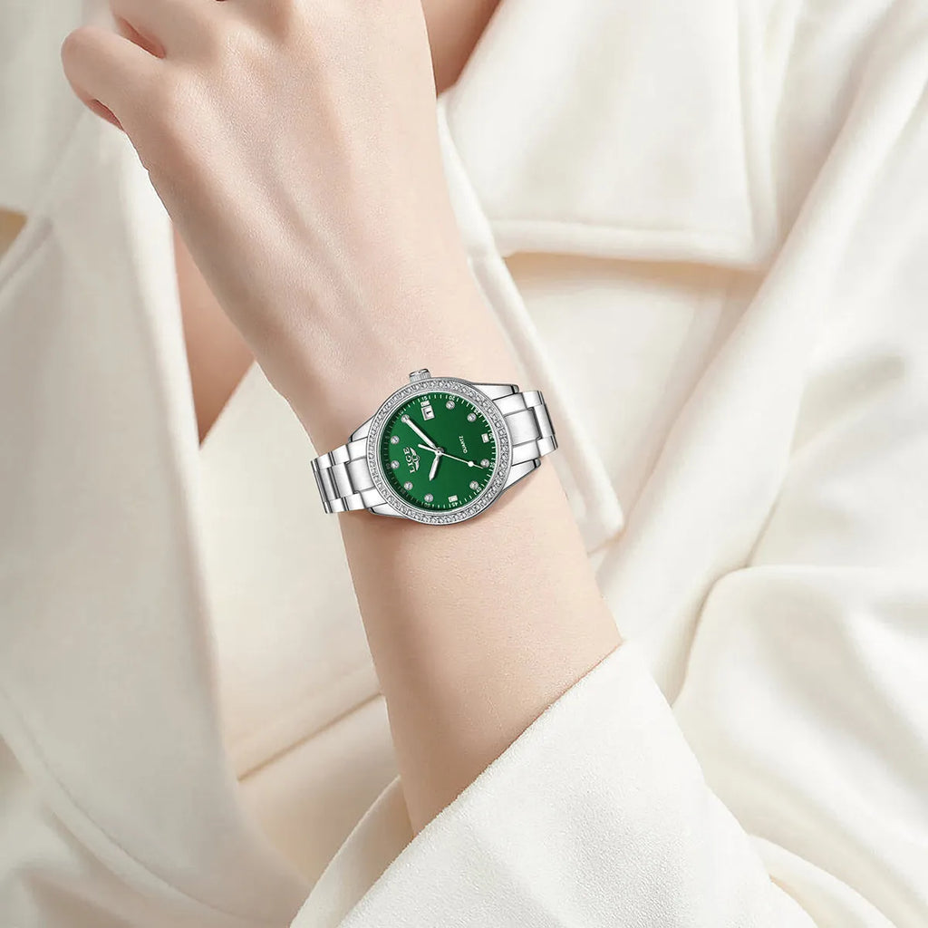 Silver quartz watch with diamond encrusted dial and luminous hands on stainless steel strap