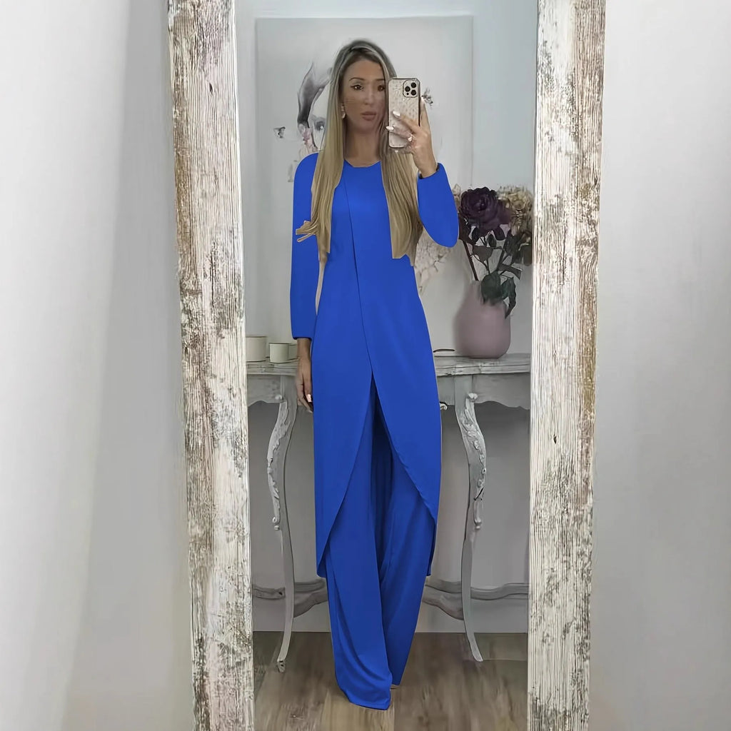 Women's black polyester two-piece lounge set with long sleeve top and loose trousers on a hanger.