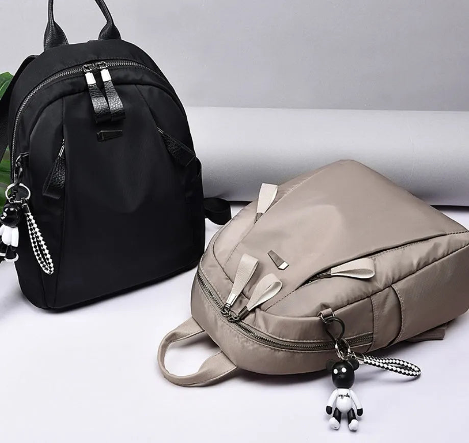 Medium Oxford cloth rucksack in wine red colour showing internal organisation pockets