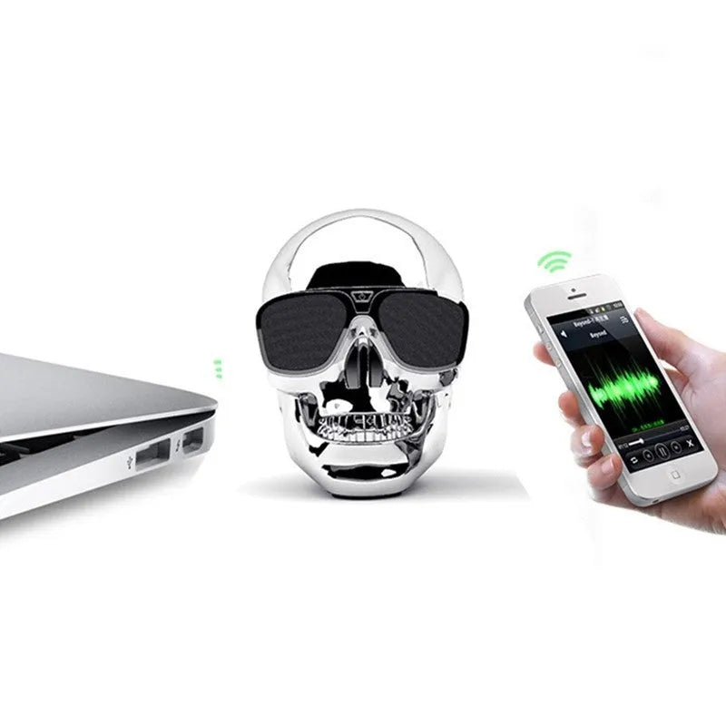 Skull-themed portable wireless Bluetooth speaker in choice of six colours on a table.