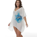 White plus size loose beach cover-up blouse for sun protection over swimwear.