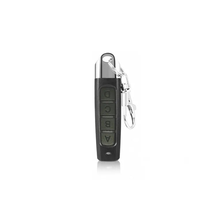 Rolling door remote control unit shown in black, with dimensions 6.7cm long.
