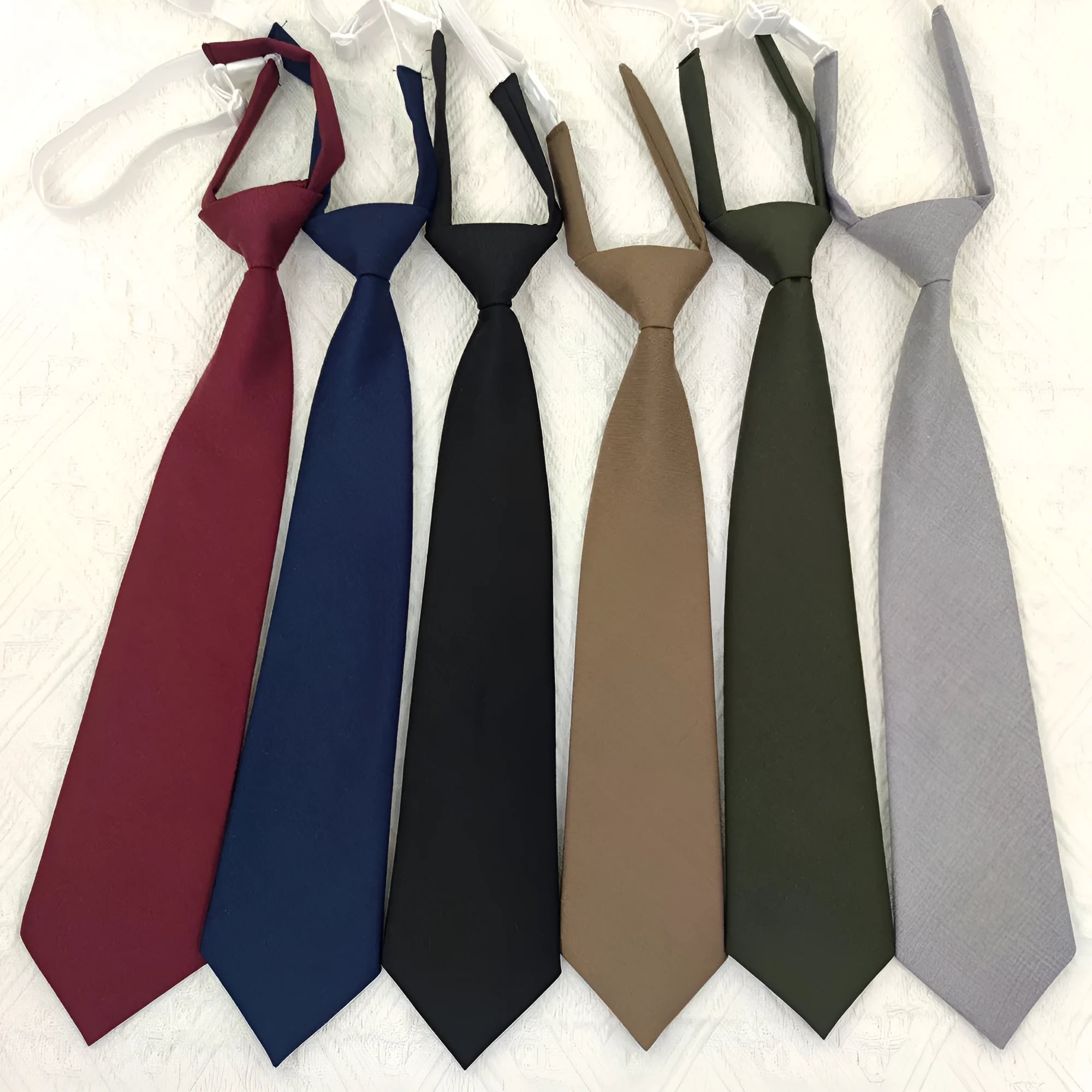 Men's solid colour cotton bow tie in arrow-type style on a white background