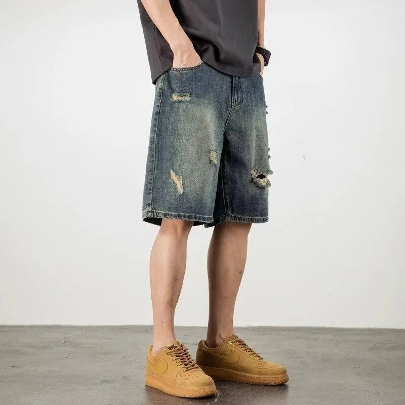 Men's blue retro wash loose fit denim shorts with straight legs on a mannequin.