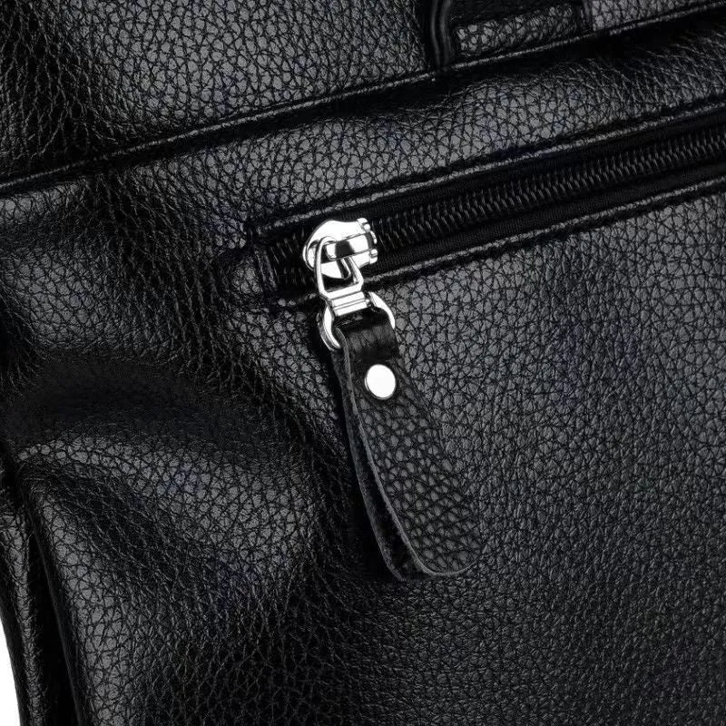 Black PU leather men's messenger shoulder bag with splicing design, 35x30x4cm.