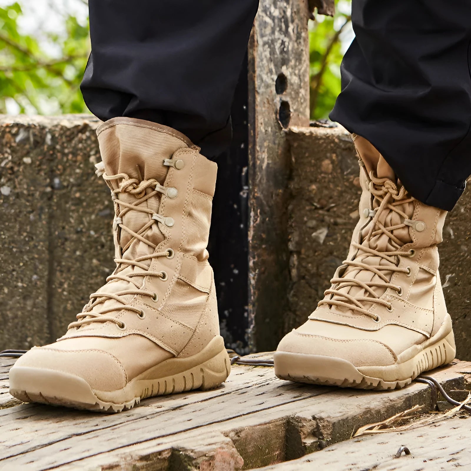Black and sand coloured Yulong tactical combat boots for outdoor hiking and sports.