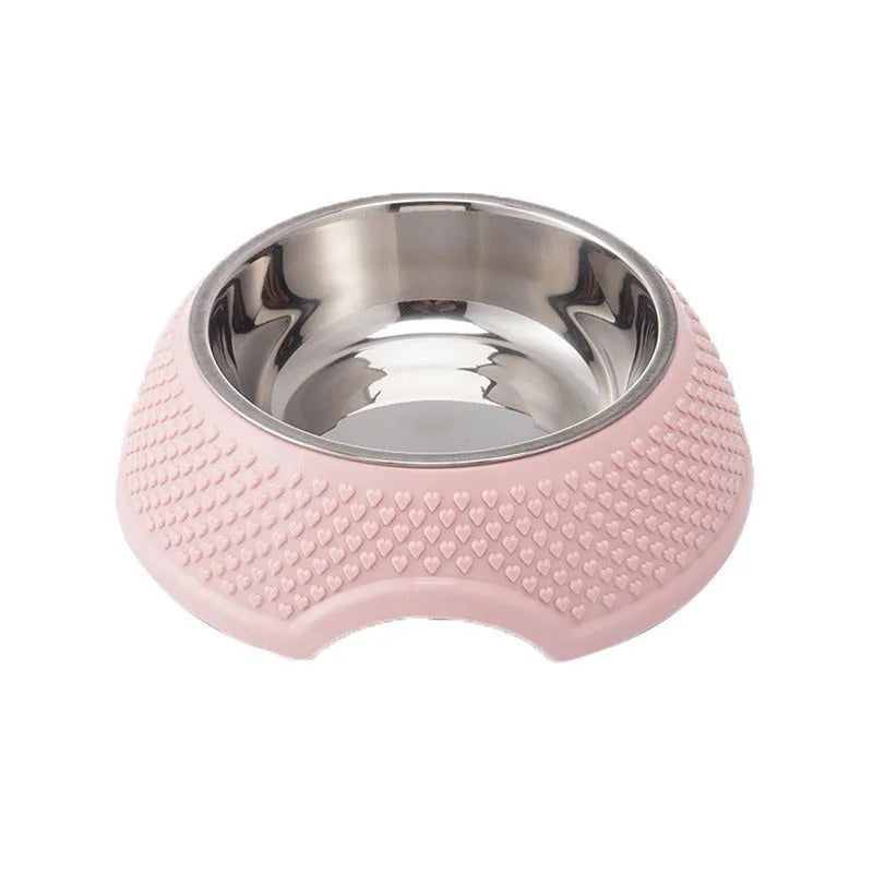 Blue stainless steel pet bowl with a non-slip black base on a kitchen floor.