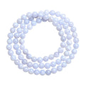 Blue agate bracelet with patterned ball and striped scattered beads showing three-circle construction