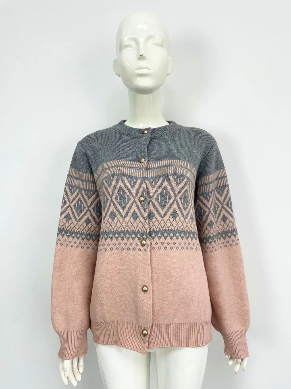 Women's grey alpaca wool cardigan with a red and white diamond knit pattern and long sleeves.