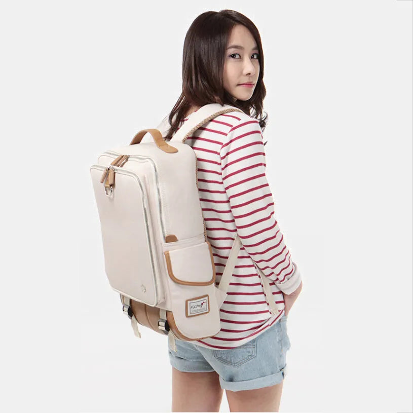 Large grey Korean-style backpack made of Oxford cloth, shown next to a laptop for scale.