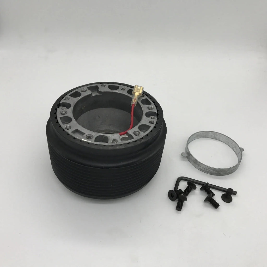 Black plastic and aluminium steering wheel connector hub adapter for Mazda R-2 model