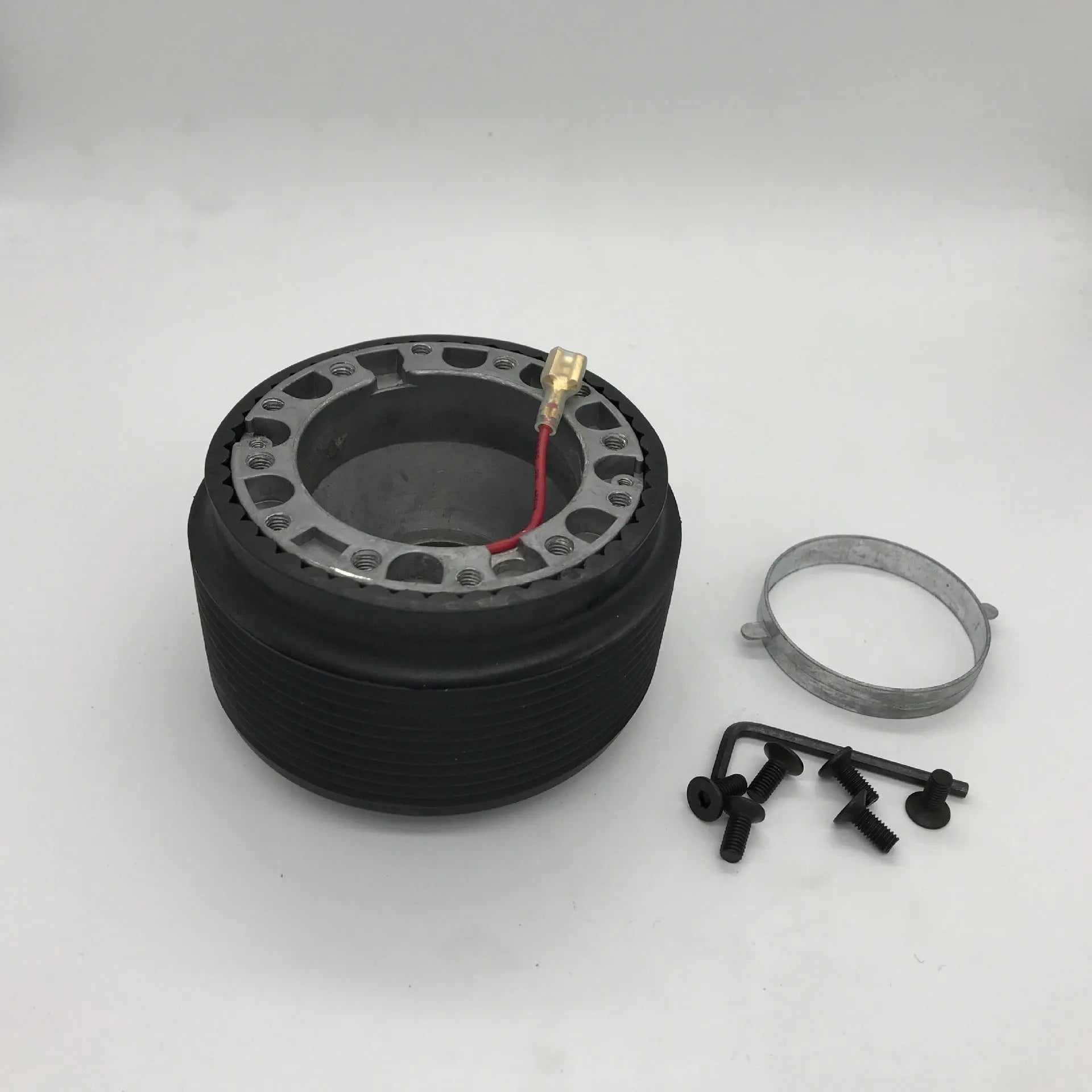 Black plastic and aluminium steering wheel connector hub adapter for Mazda R-2 model
