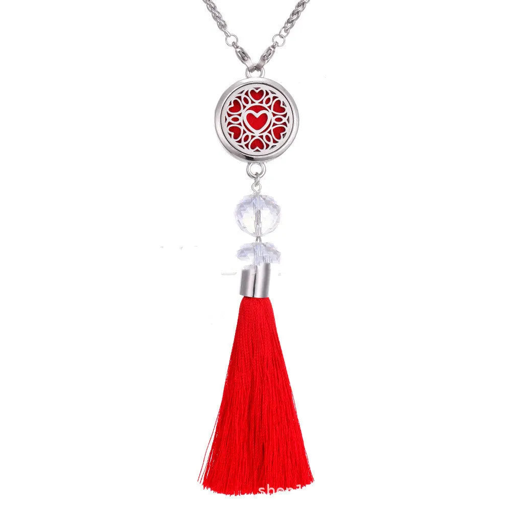 Alloy tassel car pendant with chain hanging, showing 12mm diameter fragrance compartment and coloured cotton inserts