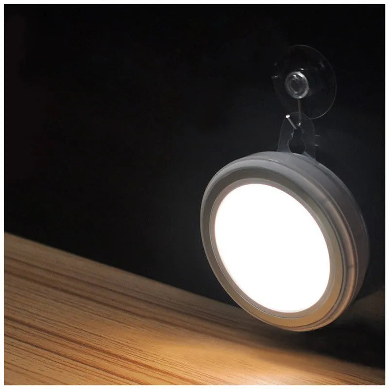 Circular smart motion sensor LED light with infrared sensor and five LEDs.