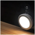 Circular smart motion sensor LED light with infrared sensor and five LEDs.