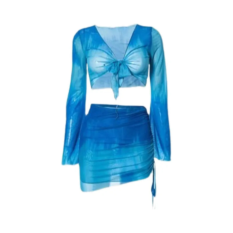 Women's blue four-piece bikini swimsuit set showing high-waisted briefs and coordinating shirt and skirt components