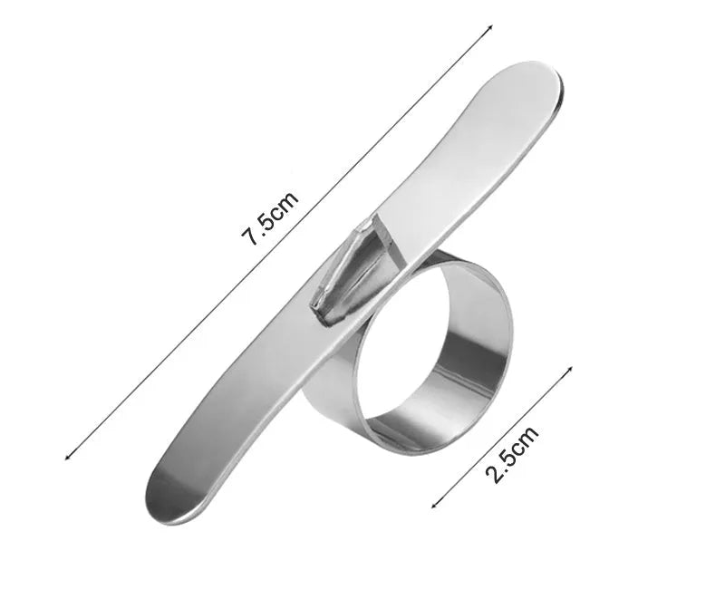 Silver stainless steel orange peeler ring on a citrus fruit