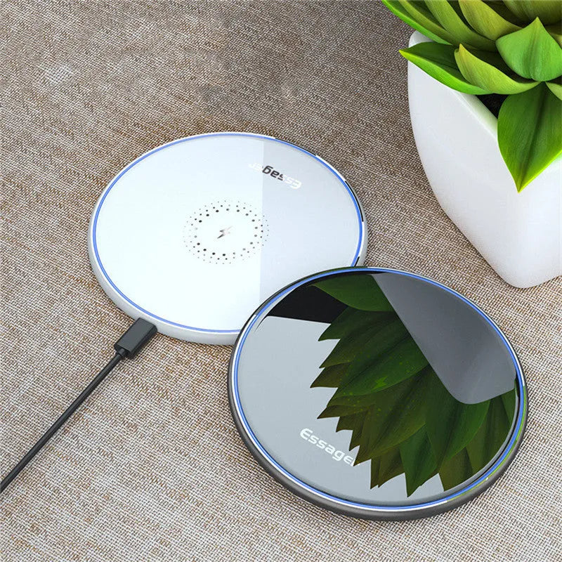 Black aluminium wireless charging pad with LED indicator light on smooth surface